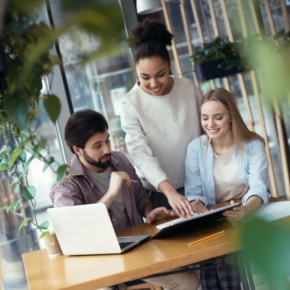 young-people-coworking-together-at-creative-office-sitting-woman.jpg